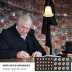 Coin collector organizing coins in the open navy 300-pocket album
