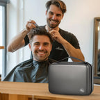 Barber styling a customer's hair beside the closed gray clipper case