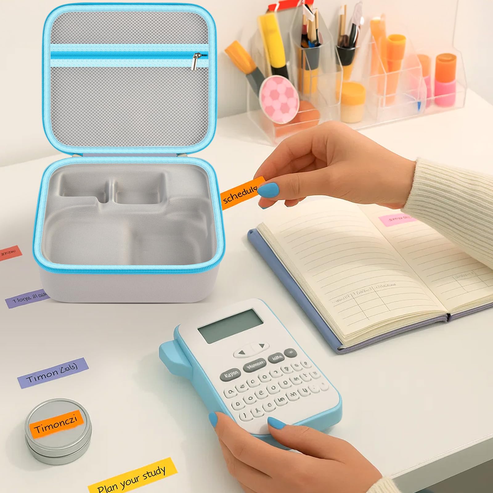 Open label maker case with divided molded interior beside office supplies