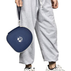 Person carrying the navy blue headphone case by its wrist strap