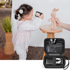 Black protective digital camera case shown beside a child using a compact camera