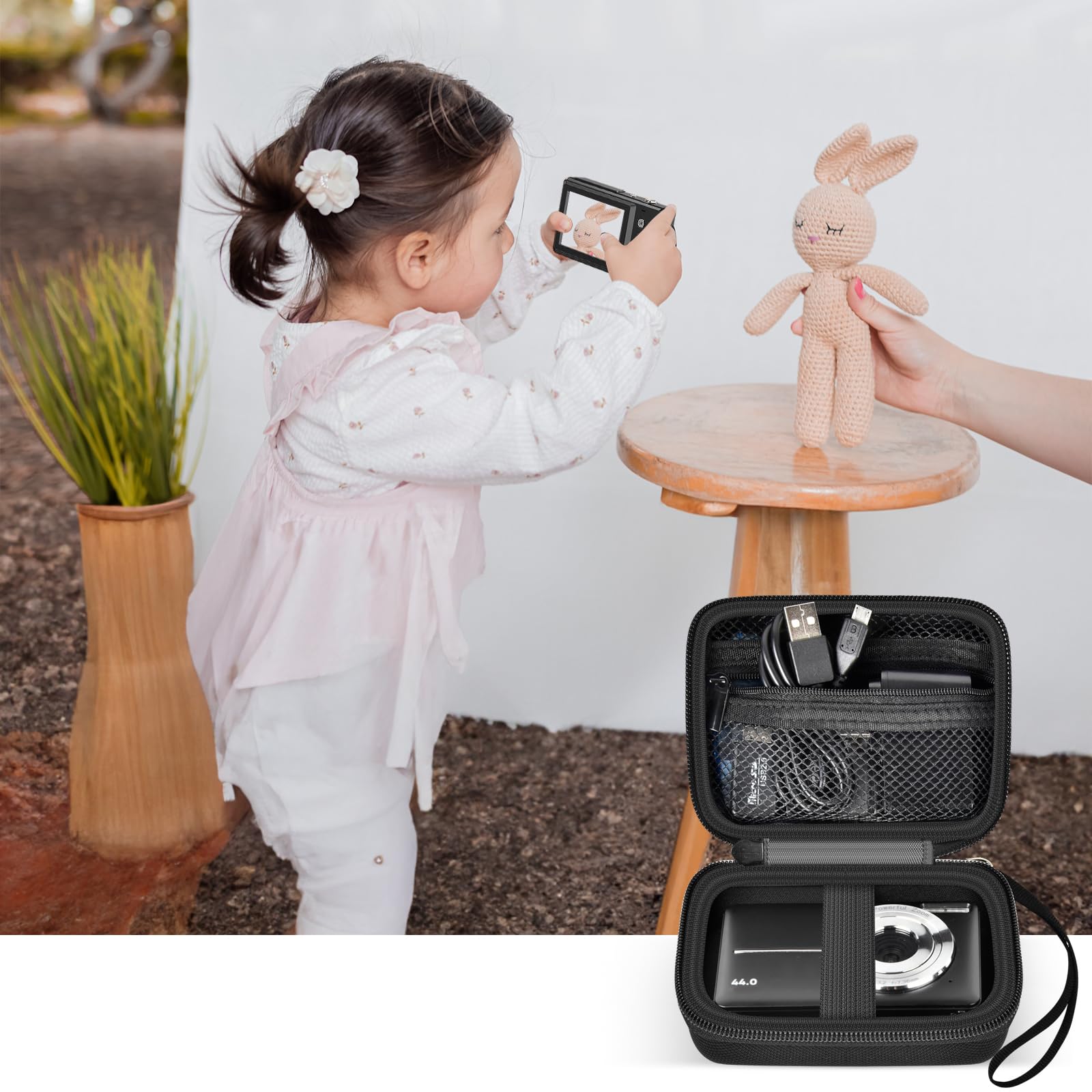 Black protective digital camera case shown beside a child using a compact camera