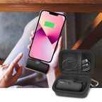 Open black case organizing a mini power bank and cable beside a charging phone