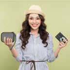 Woman holding the gray camera case beside a compact digital camera