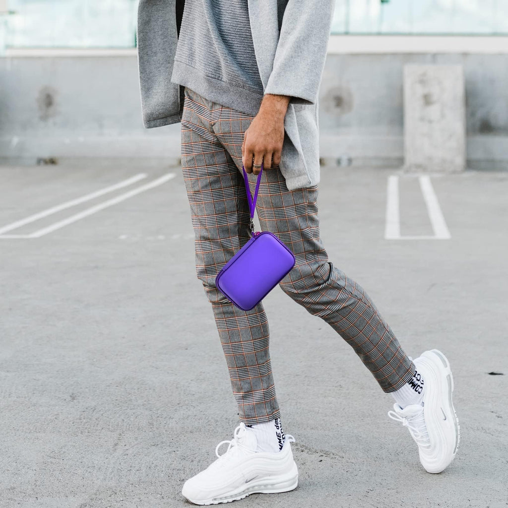 Person carrying the purple charging station case by its wrist strap