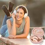 Woman wearing headphones beside the open pink carrying case