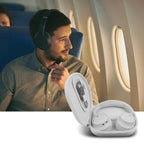 Person carrying the light gray headphone case by its wrist strap