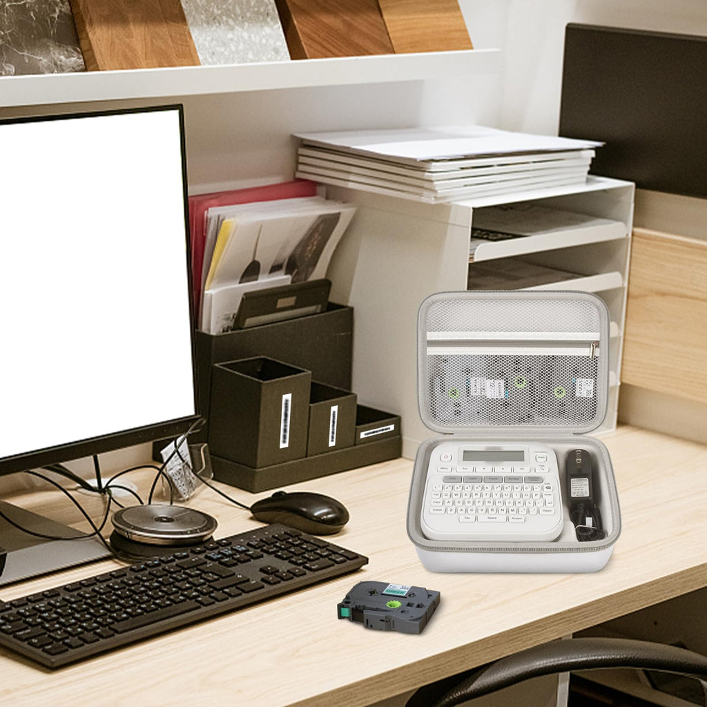 Open gray label maker case organizing a printer and tapes on an office desk
