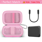 Gray SSD case beside a portable drive during outdoor laptop use
