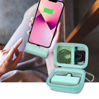 Open mint green case organizing a mini power bank and cable beside a charging phone