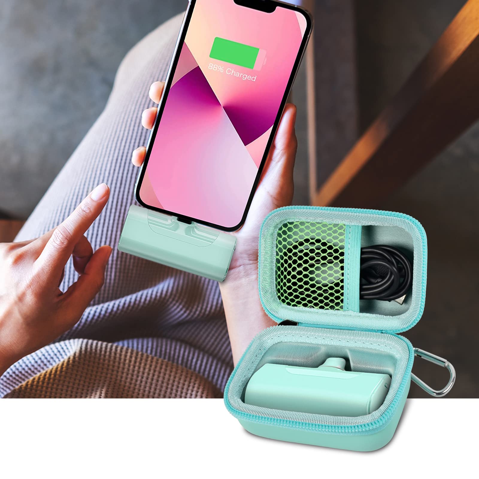 Open mint green case organizing a mini power bank and cable beside a charging phone