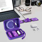 Open purple case organizing a foldable magnetic charger, cable, and adapter on a desk