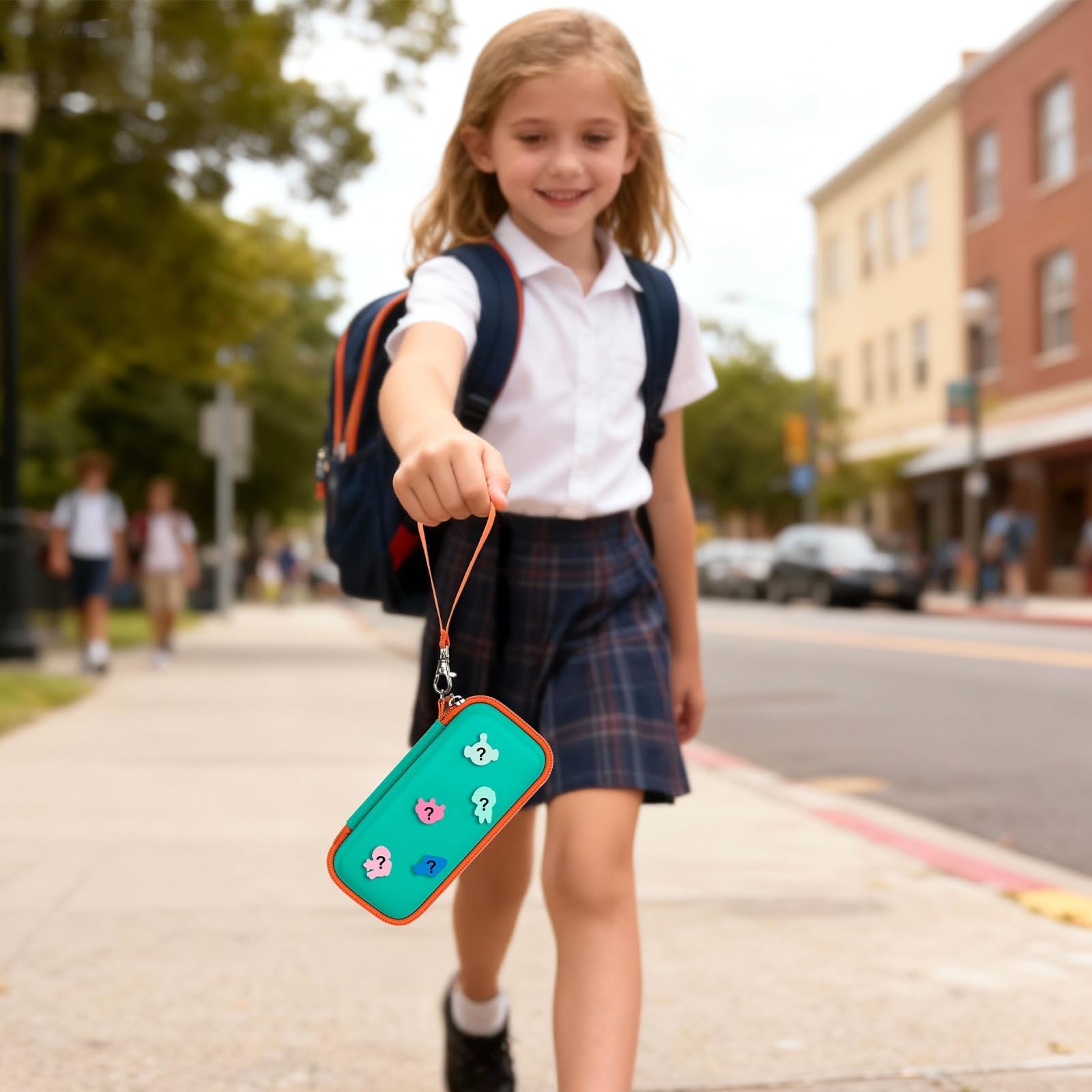 Student carrying the teal and orange 3D printing pen case by its wrist strap