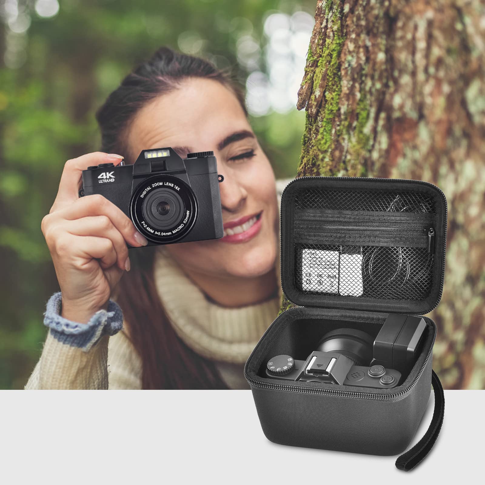 Photographer using a compact camera beside the open black organizer