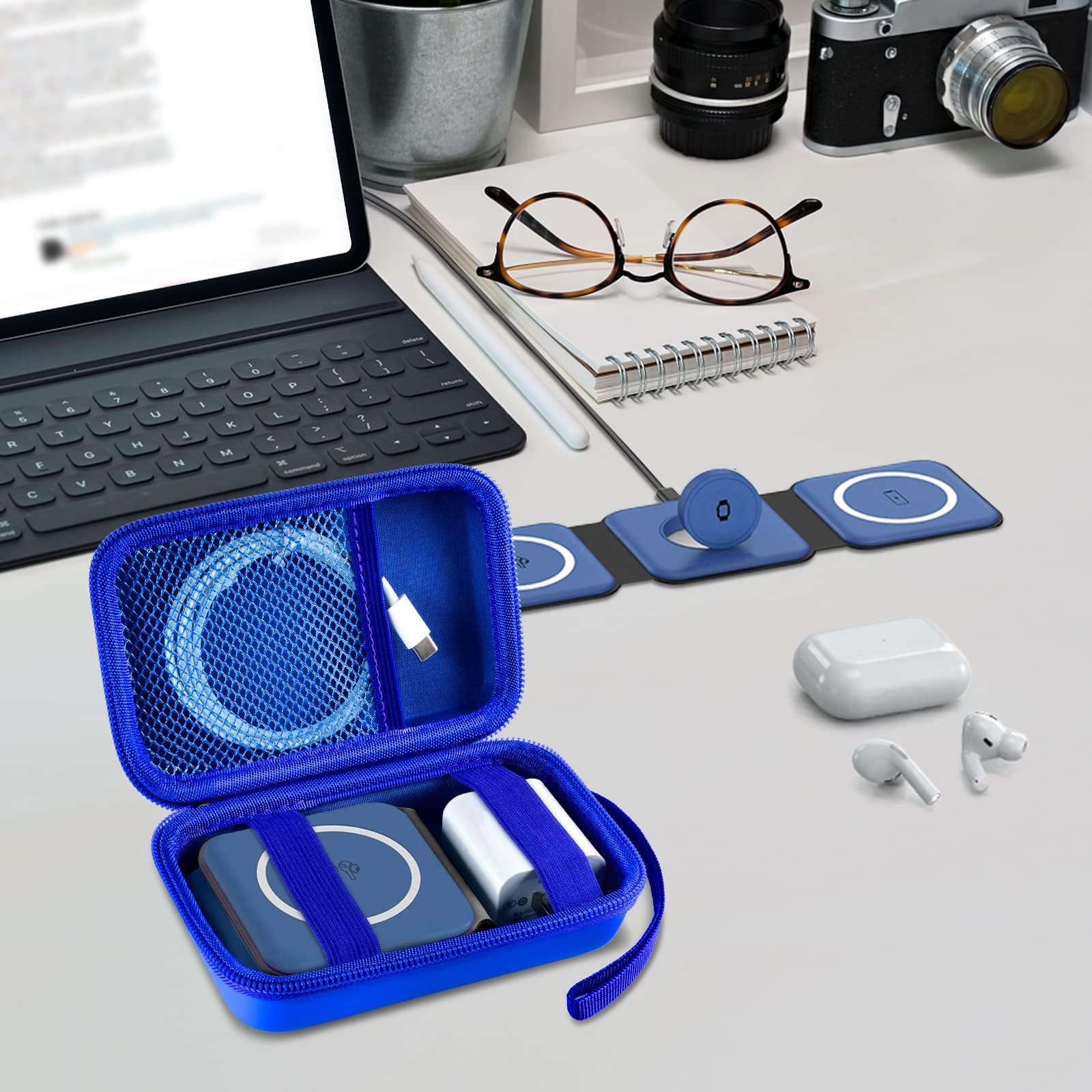 Open blue case organizing a foldable magnetic charger, cable, and adapter on a desk