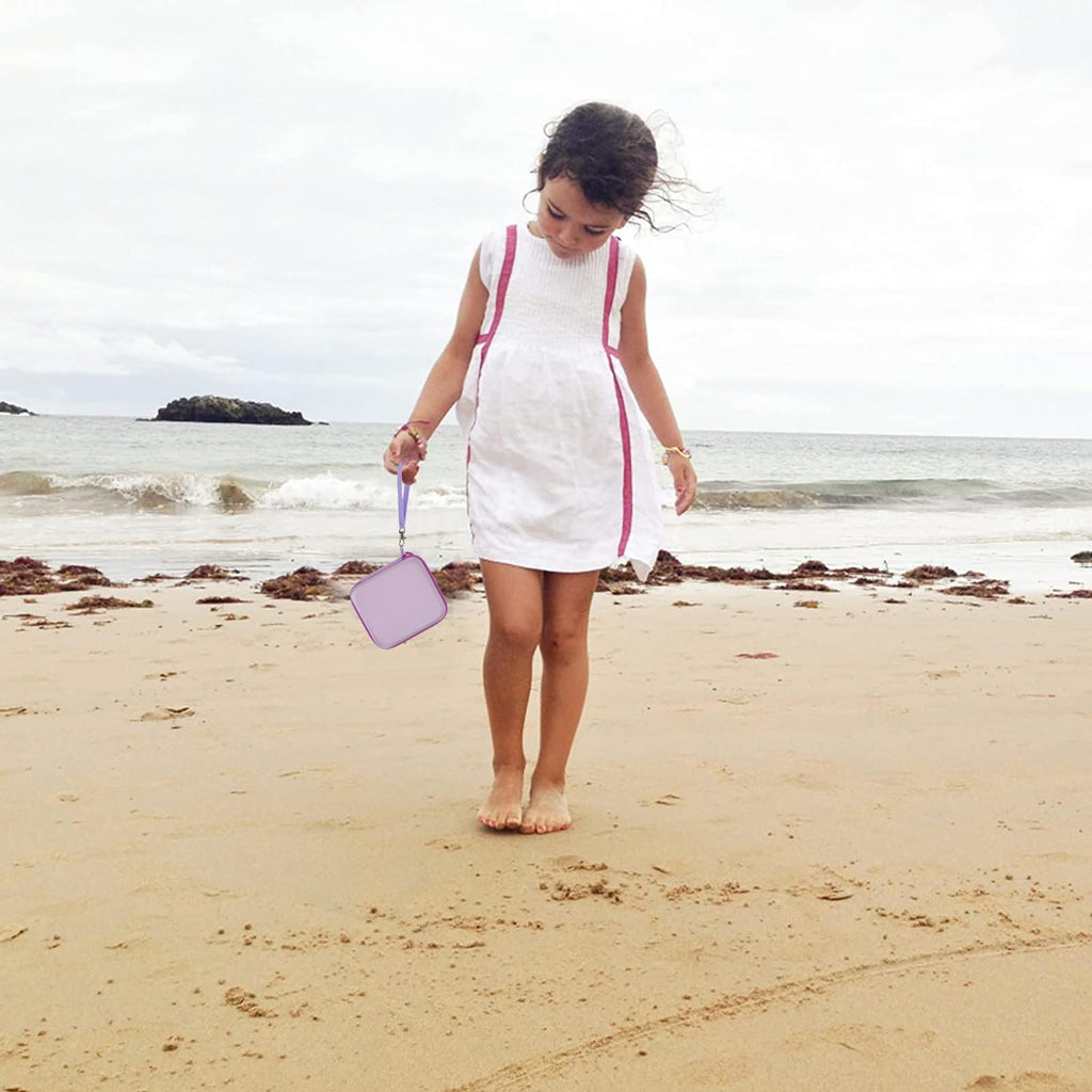 Lavender kids instant print camera case open beside a child using the camera with a parent