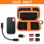 Open black and orange SanDisk SSD case with cable and memory cards; case only