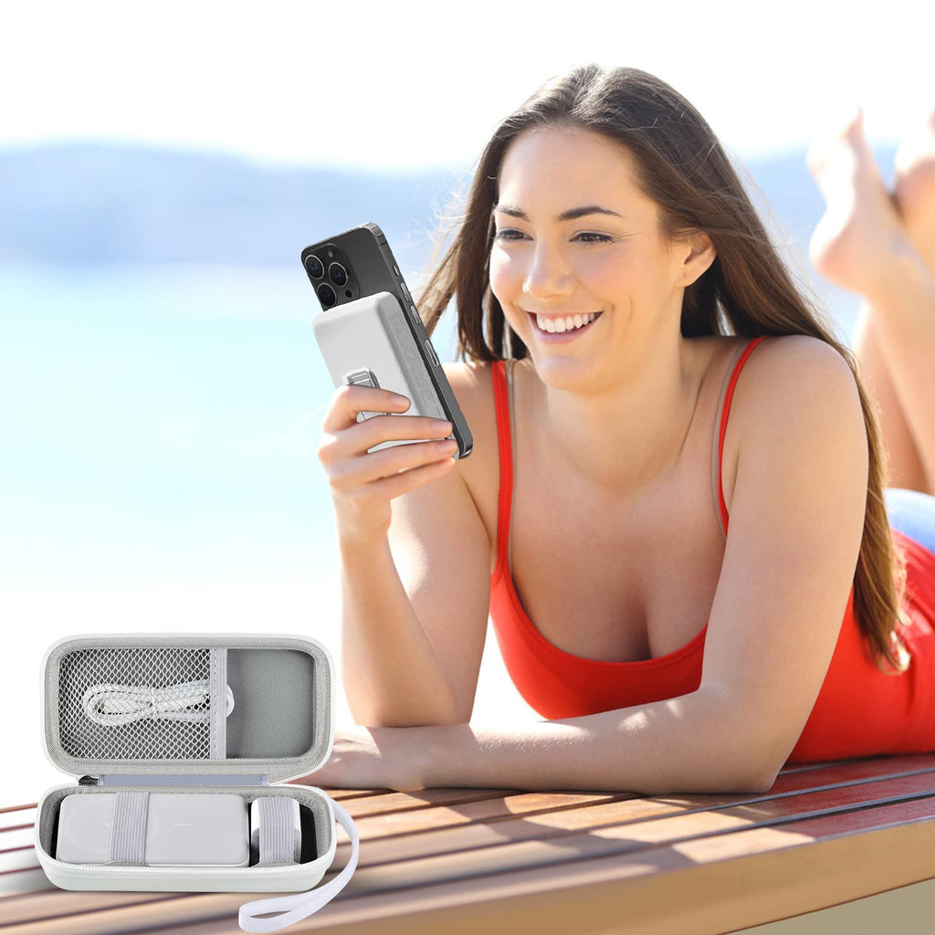 White carrying case beside a phone using a magnetic power bank