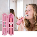 Woman brushing beside the open pink slim toothbrush travel holder