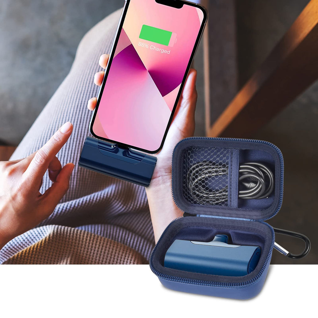 Open navy blue case organizing a mini power bank and cable beside a charging phone