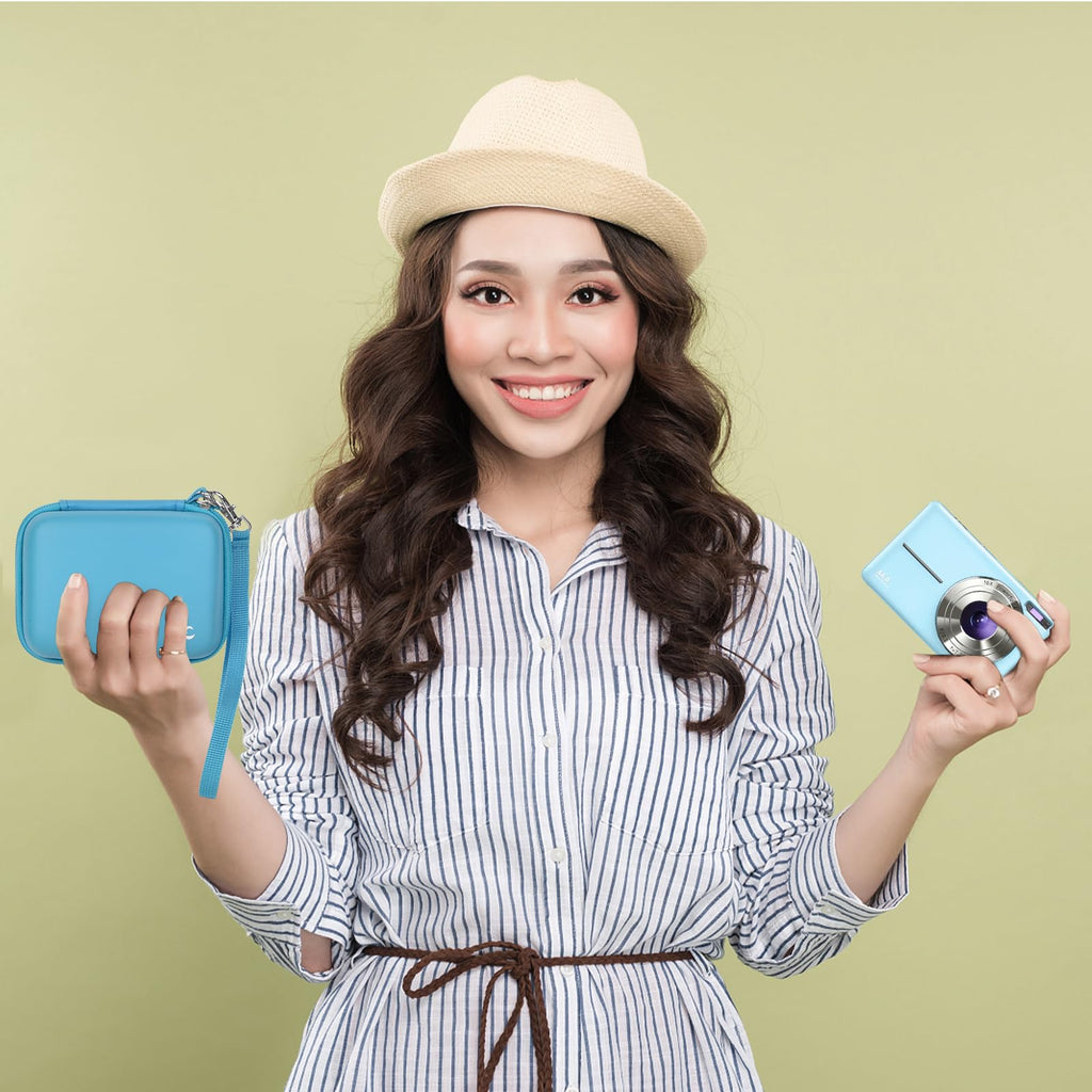 Woman holding the teal camera case beside a compact digital camera