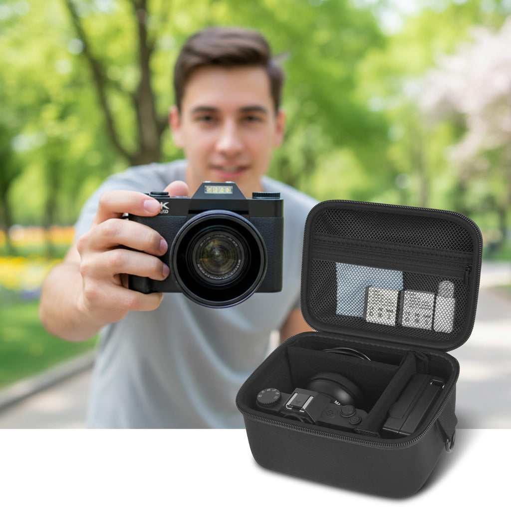 Photographer using a compact camera beside the open black organizer