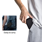 Person carrying the black SSD case by its carabiner