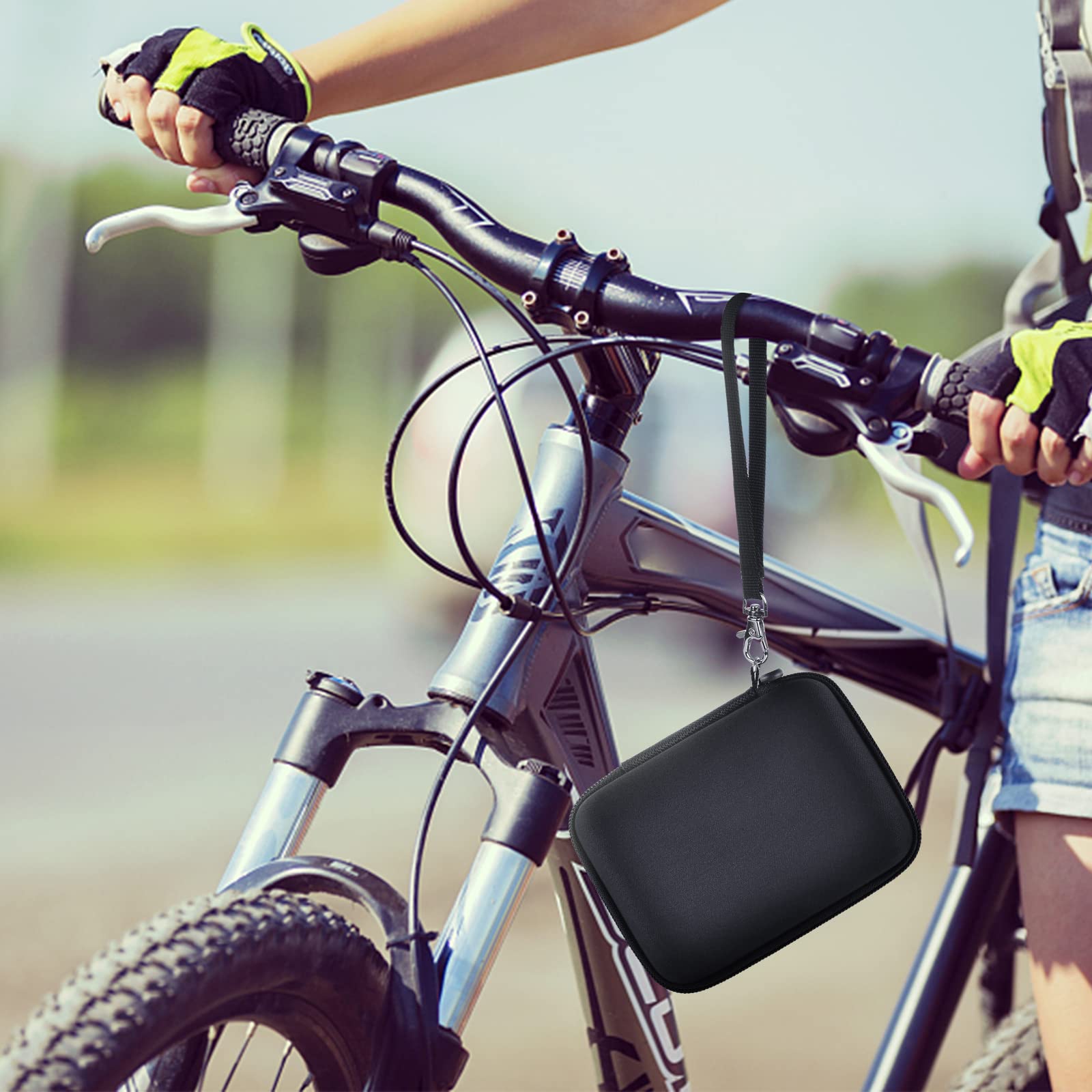 Black camera case attached to a bicycle handlebar