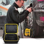 Open black and yellow air compressor bag beside a DEWALT tire inflator at a vehicle