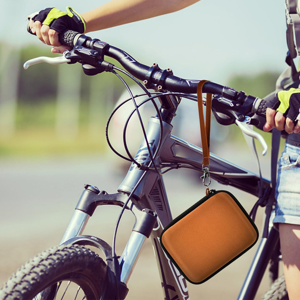 Orange camera case attached to a bicycle handlebar