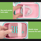 Pink and mint green speaker case interior with mesh cable pocket and elastic strap holding a JBL Go speaker