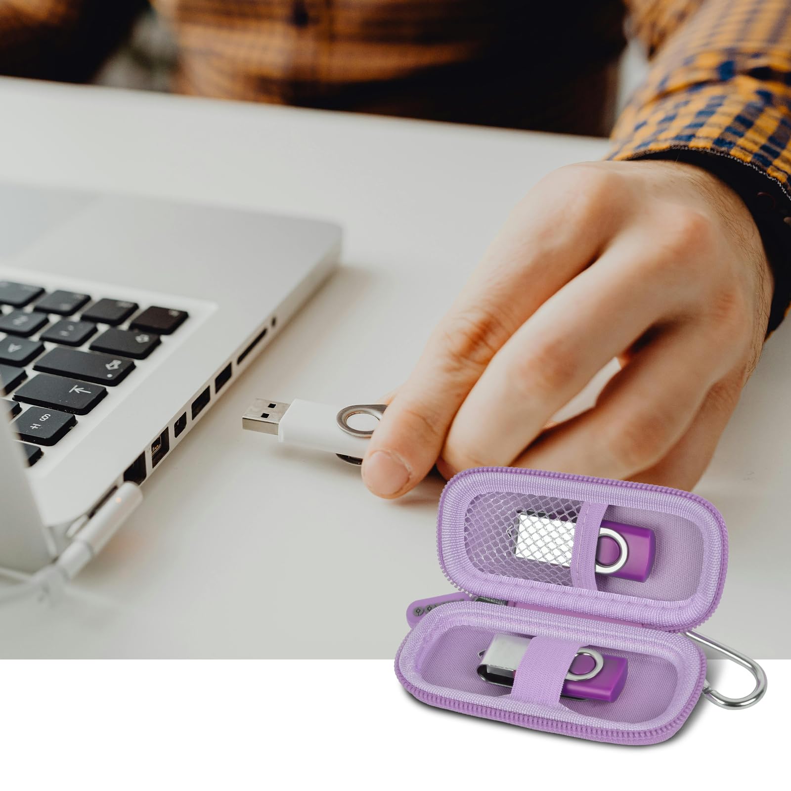 Lavender USB flash drive and SD card storage case open beside a laptop during use