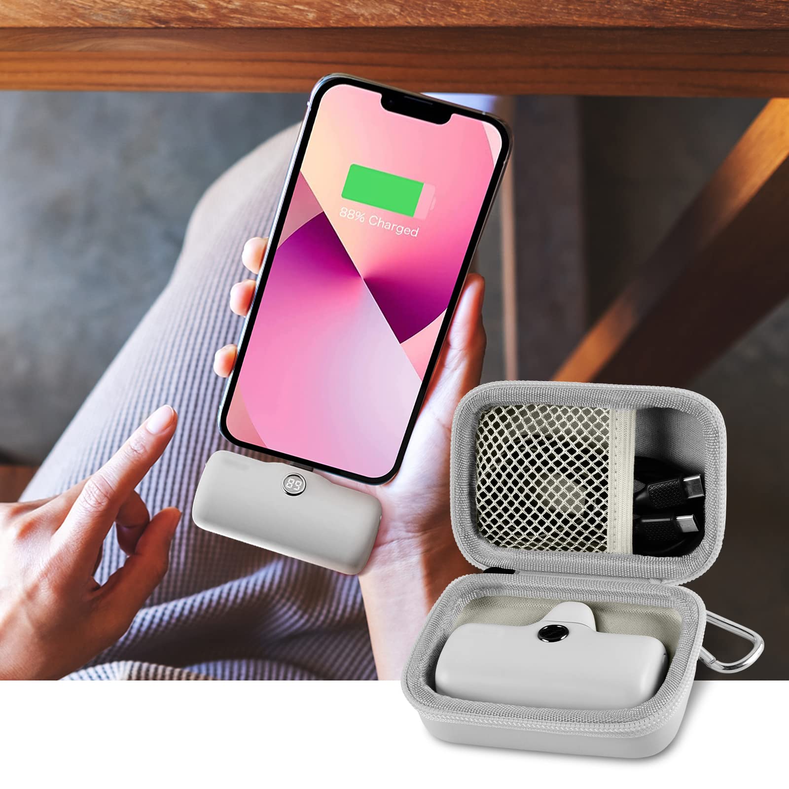 Open gray case organizing a mini power bank and cable beside a charging phone
