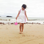 Pink kids instant print camera case carried by a child outdoors
