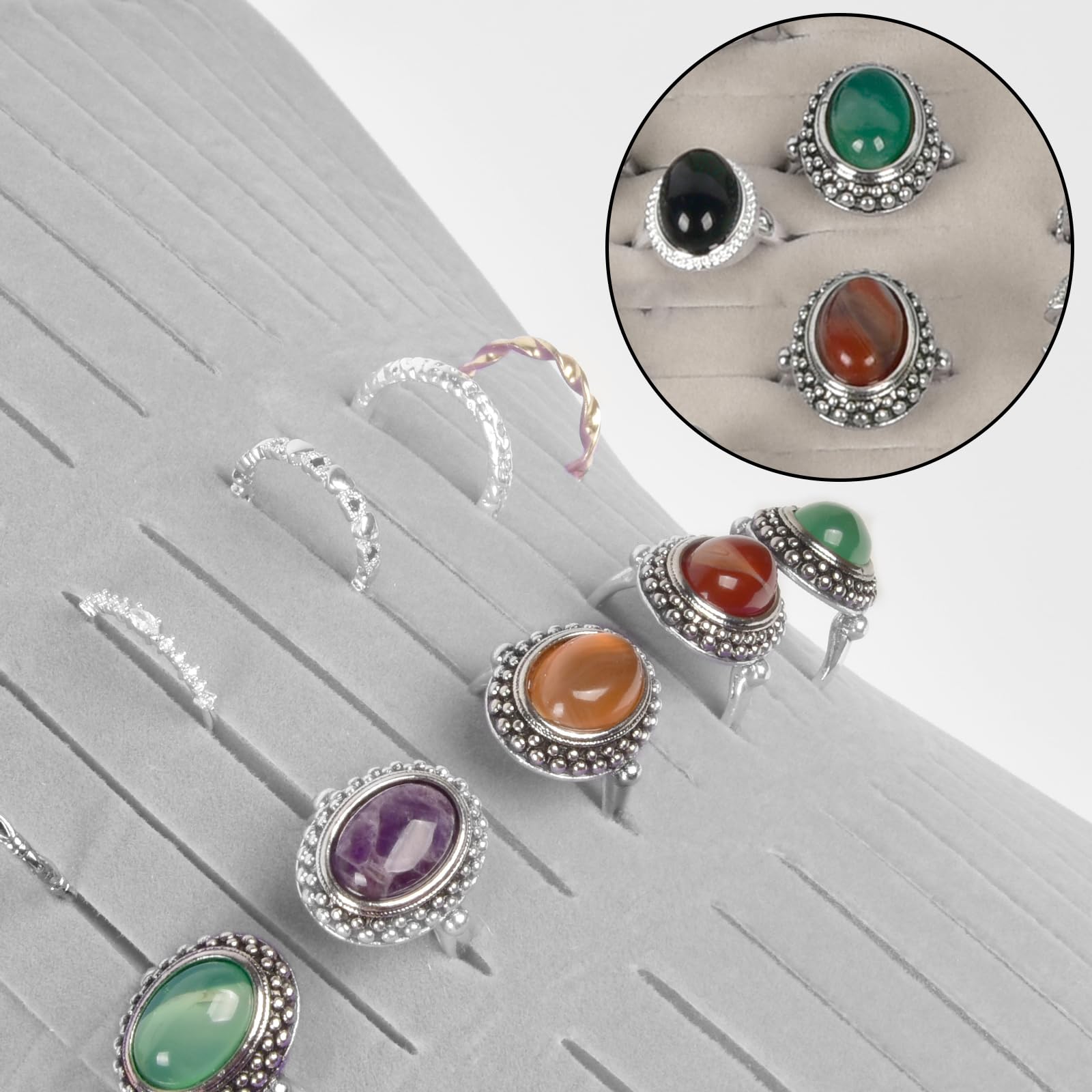 Rings and earrings displayed in the ivory organizer's parallel jewelry slots