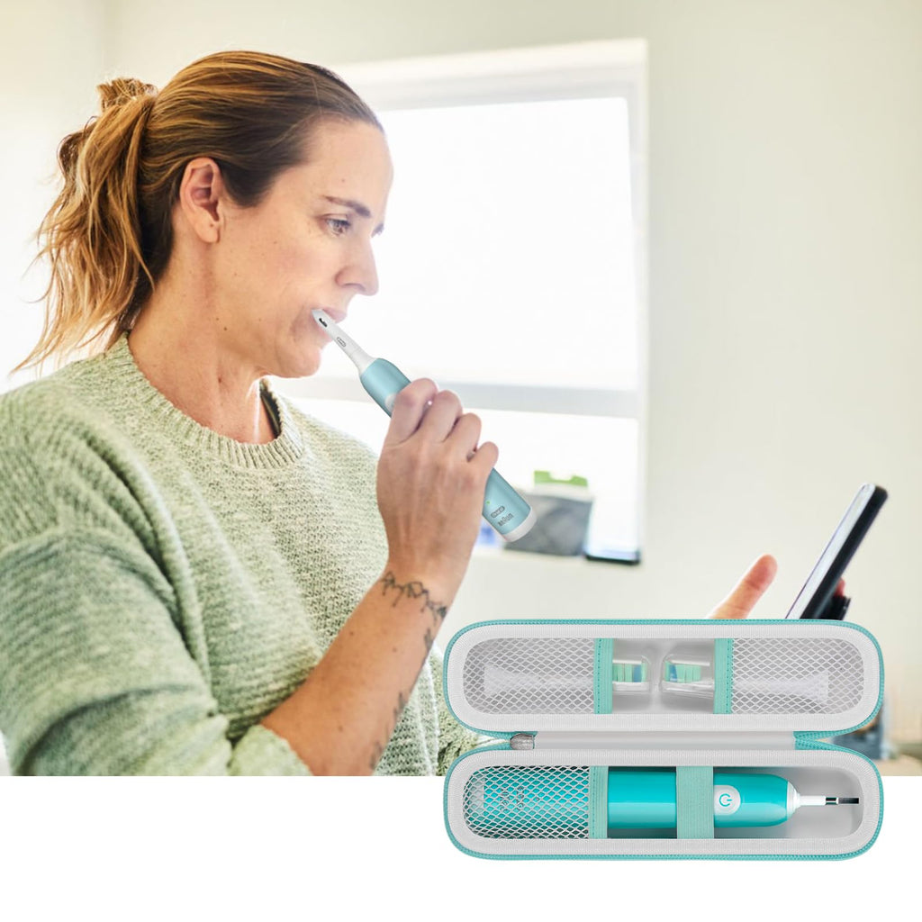 Woman using an electric toothbrush with accessories organized in the white and teal case