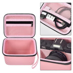 Pink camera organizer interior with mesh accessory pocket and padded divider