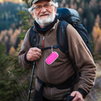 Man checking heart rhythm results beside the open pink KardiaMobile organizer