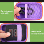 Purple and orange speaker case interior with mesh cable pocket and elastic strap holding a JBL Go speaker