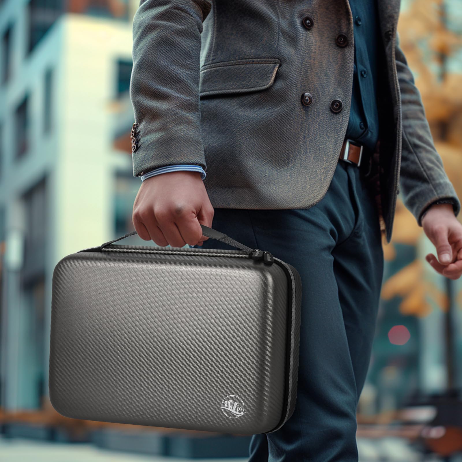 Person carrying the gray professional clipper case by its top handle