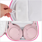 White with pink trim headphone case interior with mesh accessory pocket and folded headphones