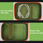 Dark green and orange speaker case interior with mesh cable pocket and elastic strap holding a JBL Go speaker