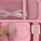 Pink case interior securing a magnetic power bank with elastic straps and cable in the mesh pocket