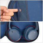 Navy blue headphone case interior with mesh accessory pocket and folded headphones