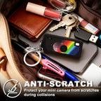 Black silicone case for Kodak Charmera keychain camera anti-scratch protection shown inside a bag