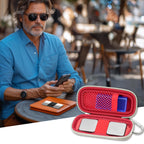 Man checking heart rhythm results beside the open red KardiaMobile organizer