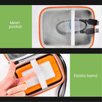 Open black and orange hard drive case showing mesh pocket and elastic drive strap