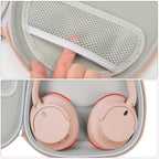 Rose gold headphone case interior with mesh accessory pocket and folded headphones