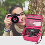 Photographer using a compact camera beside the open hot pink organizer