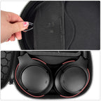 Black headphone case interior with mesh accessory pocket and folded headphones